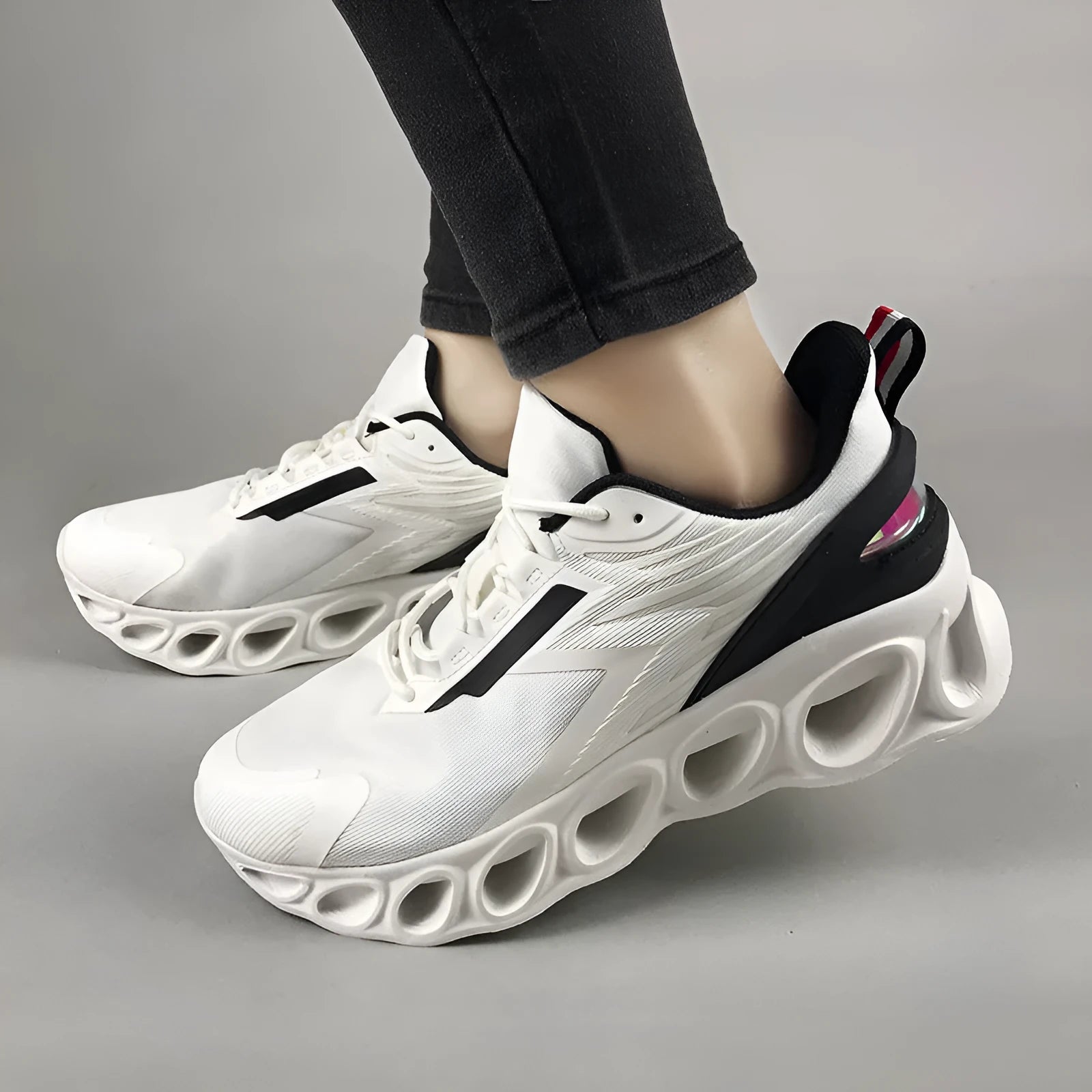Low-top casual lace-up shoes in mesh material, shown in black, white, and dark blue colour options.
