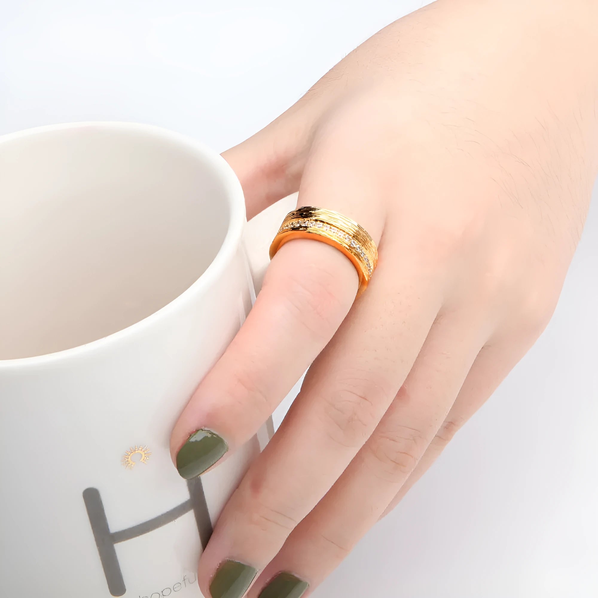 Geometric gold-colour women's zircon ring showing angular design on copper base with electroplated finish