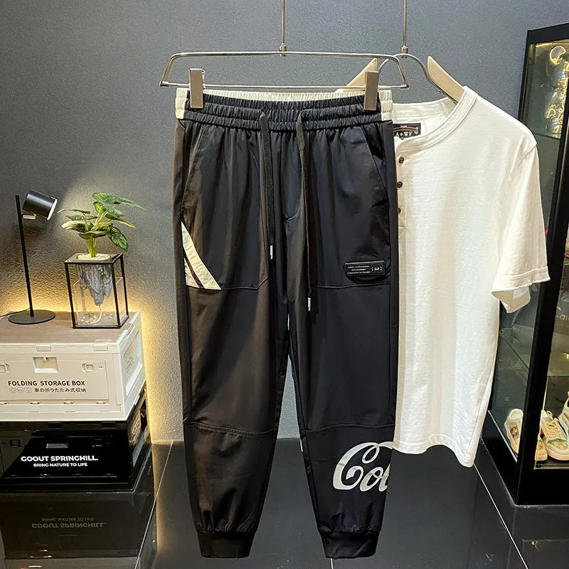Men's black cropped ankle banded trousers in ultra-thin ice silk cotton fabric