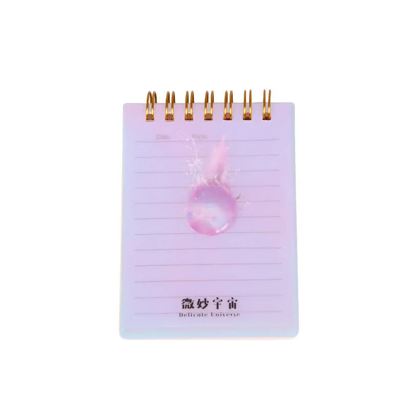 Four A7 spiral-bound pocket notebooks showing different PP cover designs: Constellation, Sakura, Universe, and Ocean.