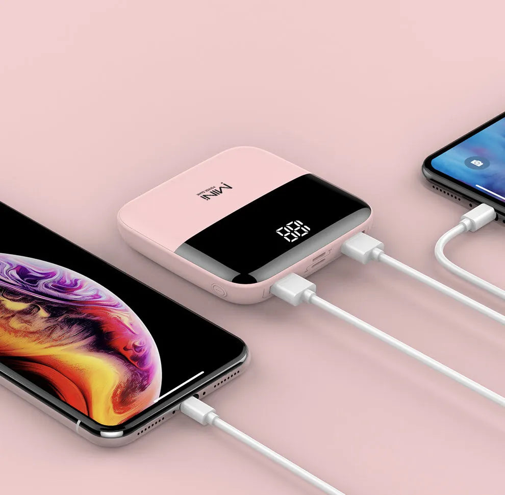 White 10000mAh portable power bank with digital display showing battery percentage and two USB ports.