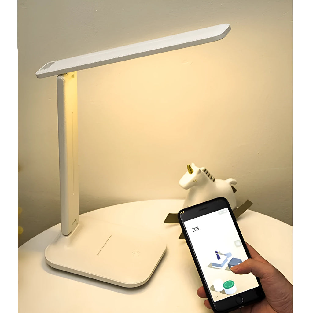 White plastic LED table lamp with touch dimming controls for bedside use