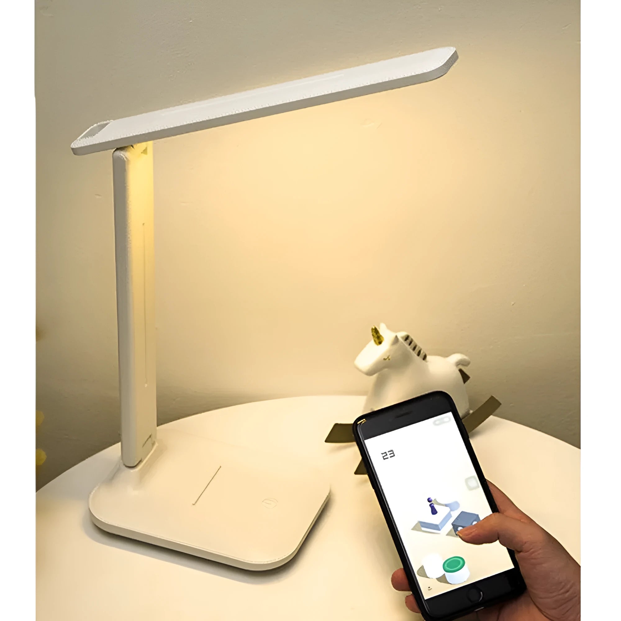 White plastic LED table lamp with touch dimming controls for bedside use