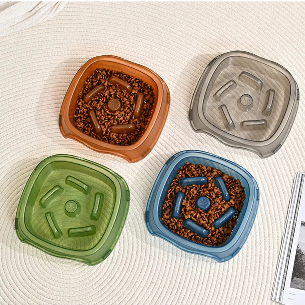 Blue slow feed anti-choke dog bowl with raised centre pattern on a non-slip base.