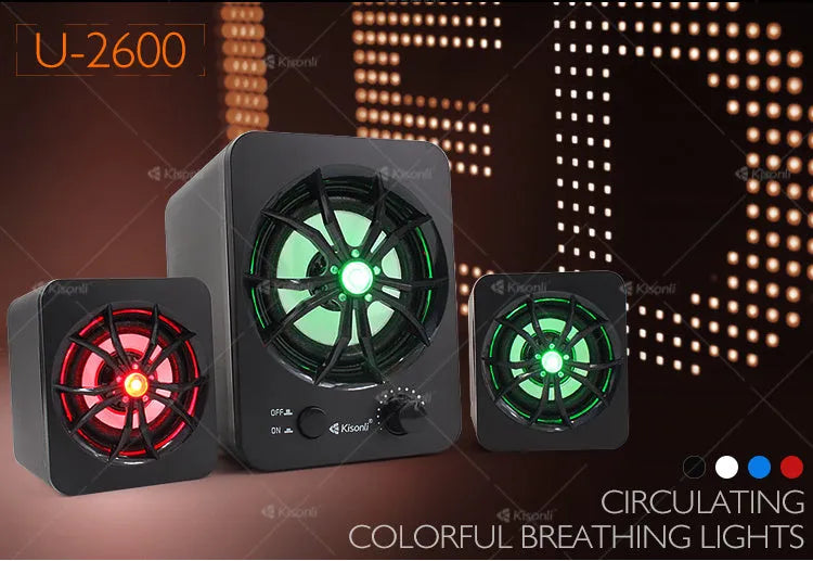 Green 2.1 USB computer speaker with colourful glowing lights on a desk.