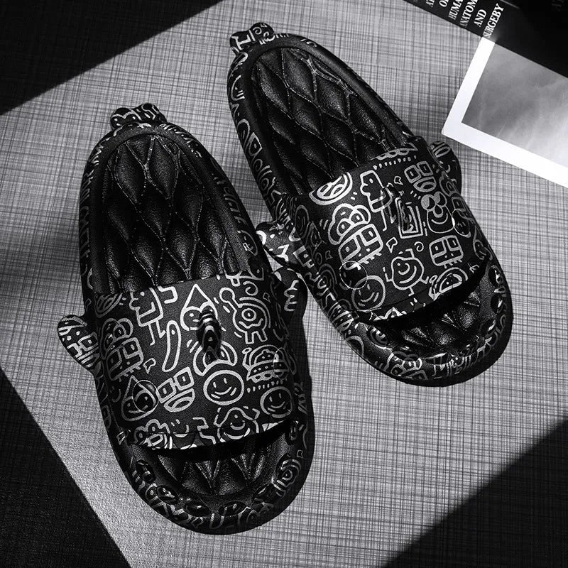 Pair of grey shark design open toe EVA home slippers on a white background.