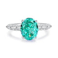 Women's S925 silver emerald ring with geometric band and oval-cut high-carbon diamond centre stone.