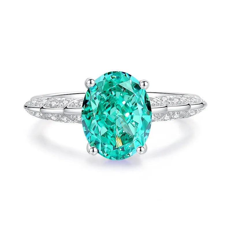 Women's S925 silver emerald ring with geometric band and oval-cut high-carbon diamond centre stone.