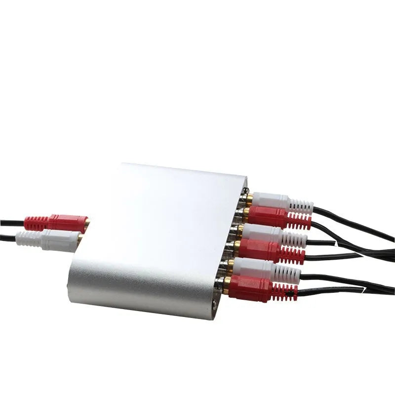 Silver aluminium audio source switch box with remote control for input/output selection.