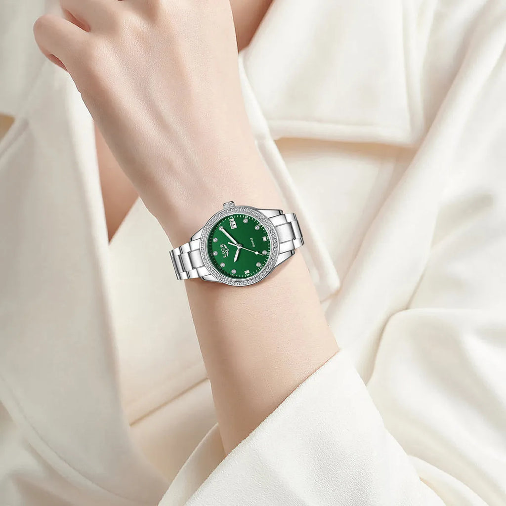 Women's silver quartz watch with diamond-encrusted bezel and luminous dial on stainless steel strap