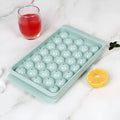Blue PE ice cube tray with lid showing 33 round moulds.