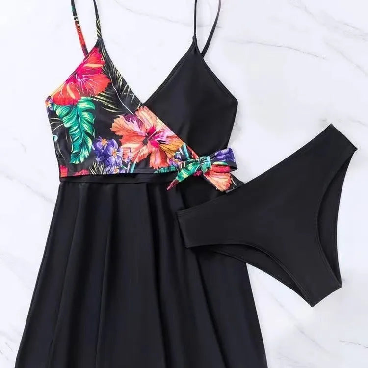 Black women's high waist briefs printed split bikini swimwear laid flat.