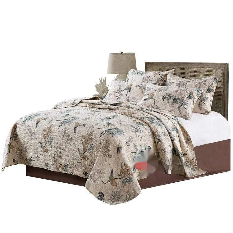 Quilted cotton bed cover set with printed pattern including bedspread and two pillowcases