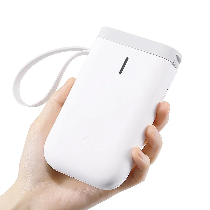 Compact D11 Bluetooth thermal label printer in black, with smartphone showing label design app.