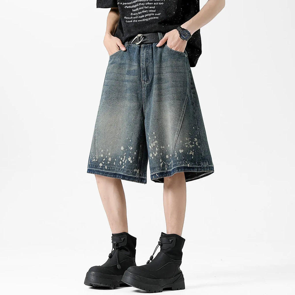 Men's retro blue denim shorts with ripped splash ink pattern and straight cut design
