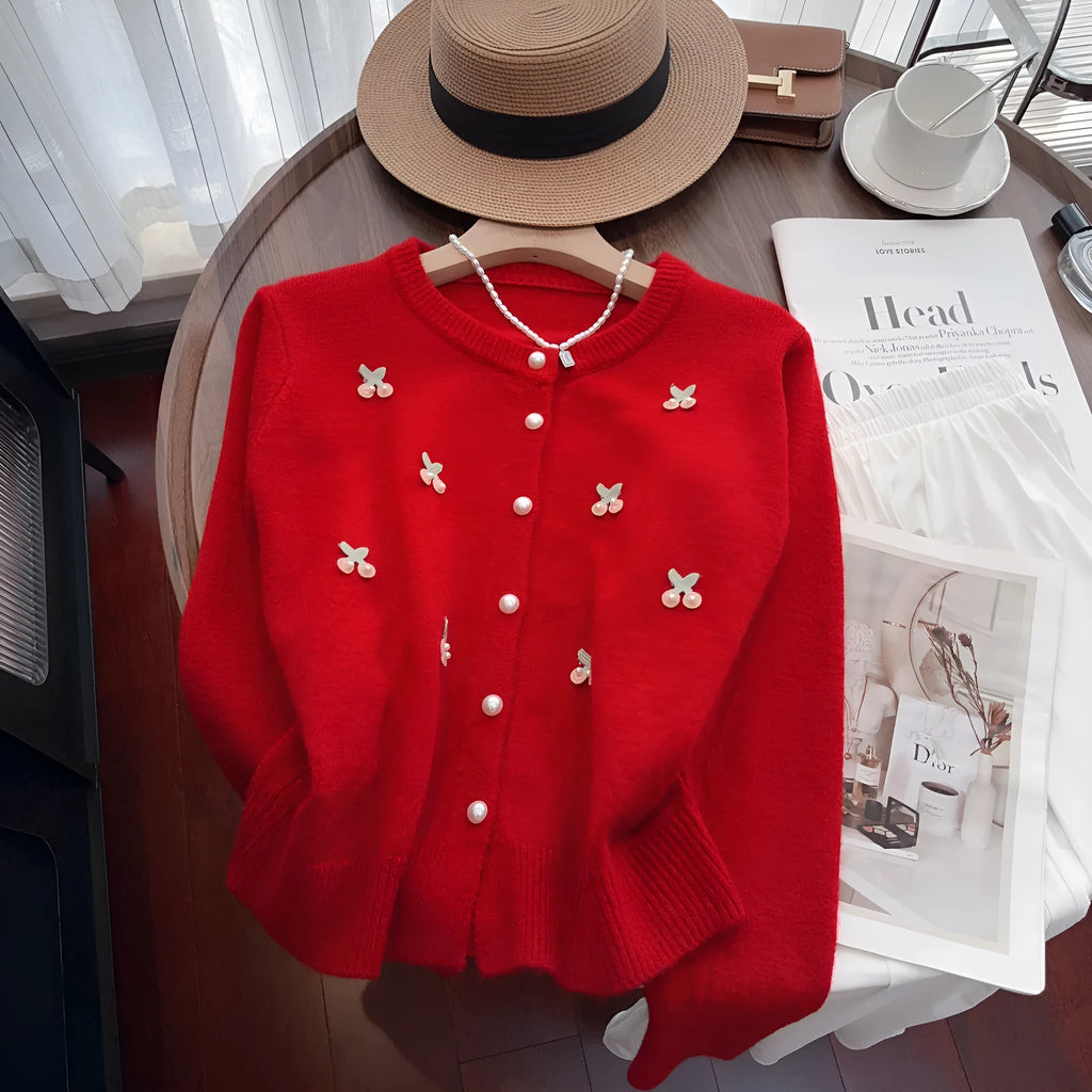 Slim fit cashmere cardigan with beaded detailing in pink, shown open as a layer.