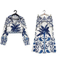 Women's casual floral print two-piece set with long sleeve top and long skirt on a hanger.