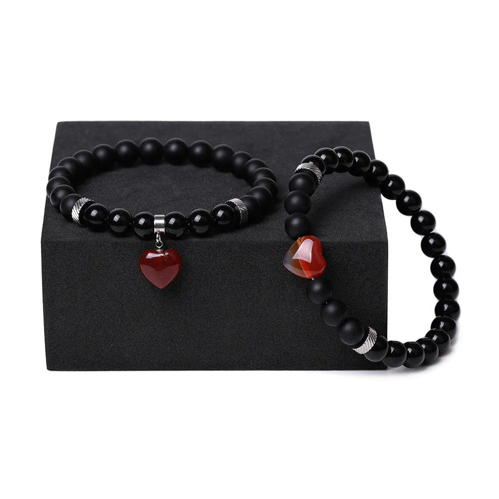 Polished natural stone couple heart bracelets in obsidian, agate, tigereye, crystal, aventurine, topaz, opal colours.