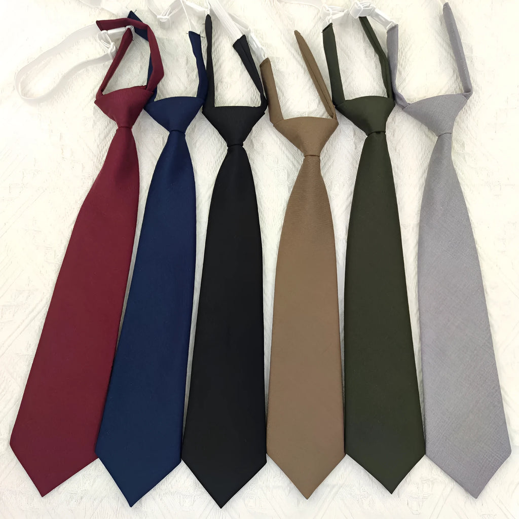 Navy blue cotton bow tie with arrow style design showing 35cm length