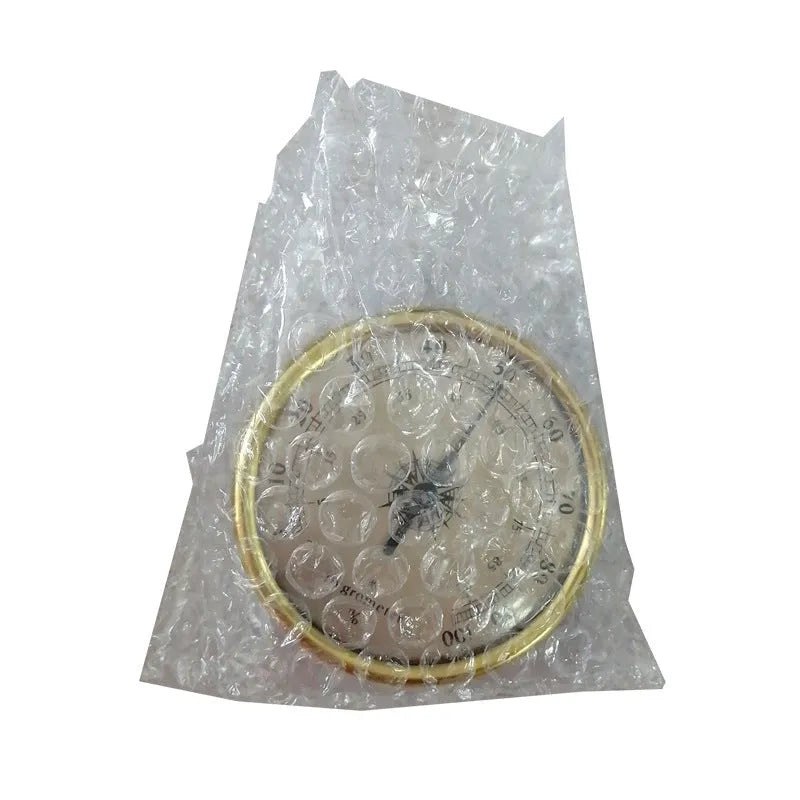 Silver aluminium analog thermometer and hygrometer with a round dial showing temperature and humidity scales.