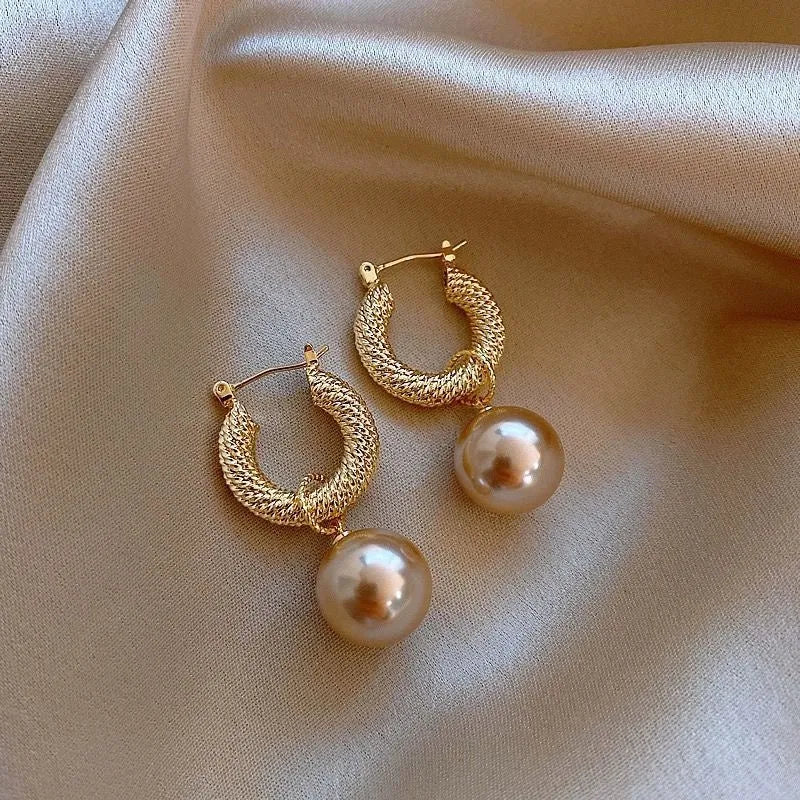 Geometric rose design copper earrings with zircon stones in an electroplated colour finish.