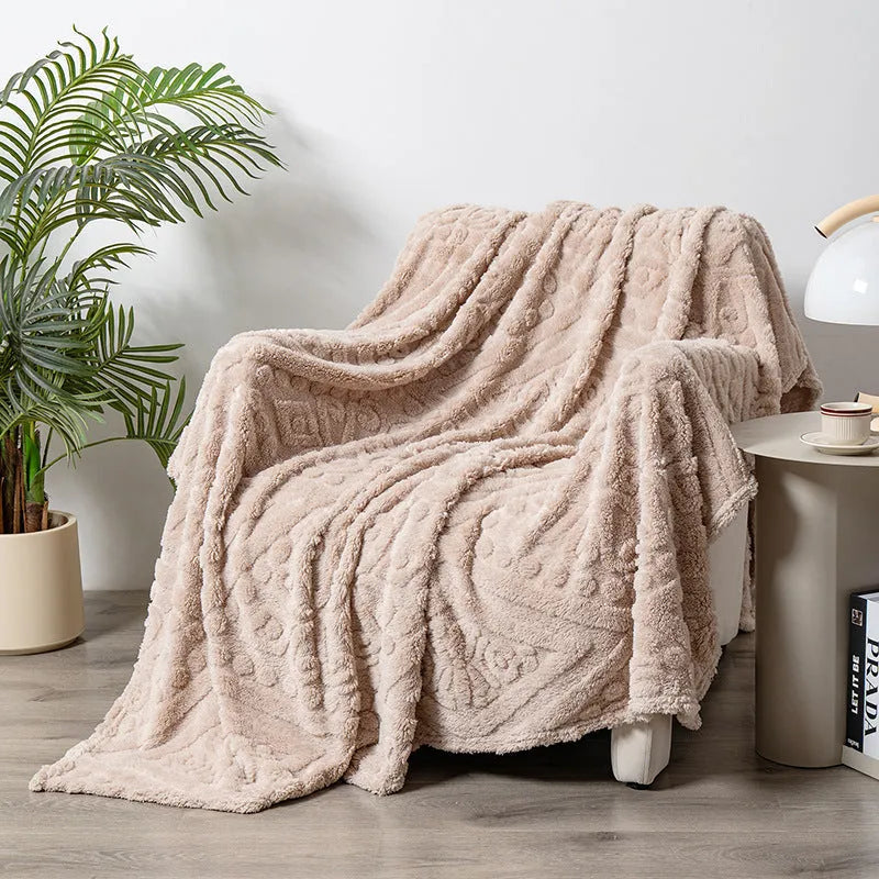 Shu cotton velvet jacquard sofa blanket in a solid colour draped over a modern sofa