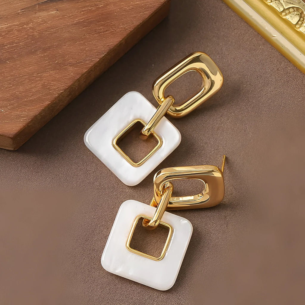 Hollow geometric square earrings with chamfered edges in electroplated copper