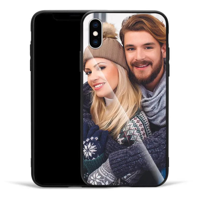 Slim patterned iPhone case with raised edges protecting a smartphone.