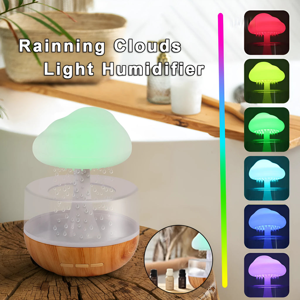 White cloud-shaped humidifier with coloured night light and mist output on a table