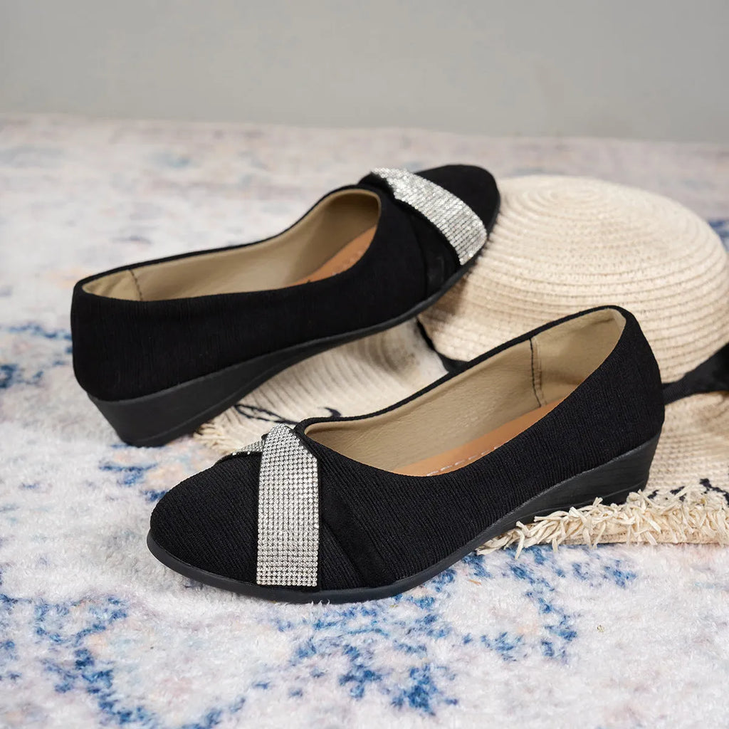 Black women's slip-on casual shoes with rhinestone decoration and a chunky heel.