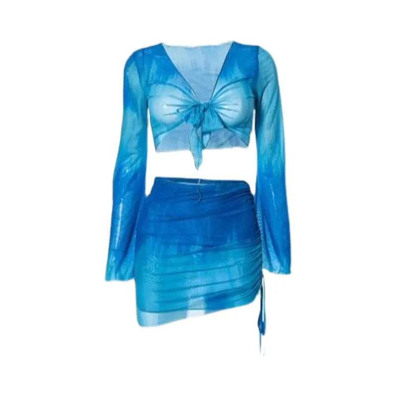 Blue high-waisted women's bikini set with matching shirt and skirt laid flat.