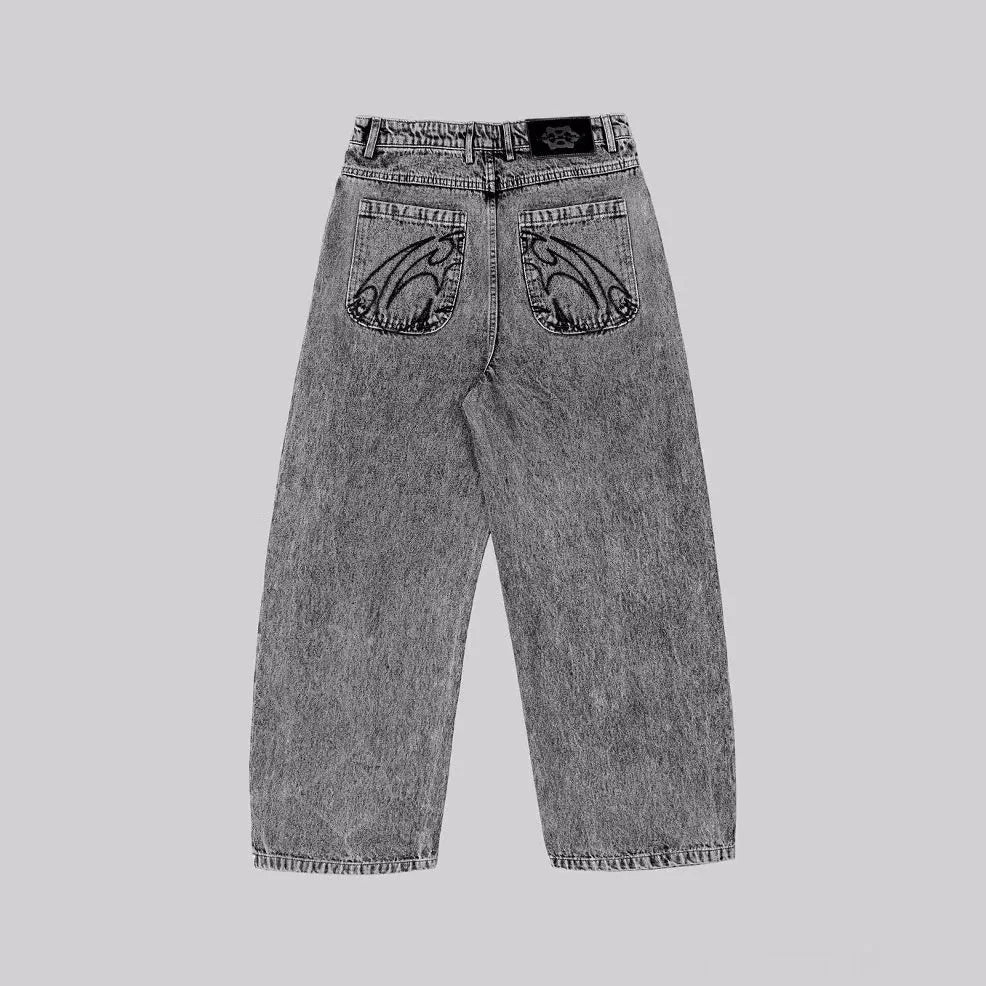 Grey loose straight-leg cotton denim trousers for men and women on a hanger