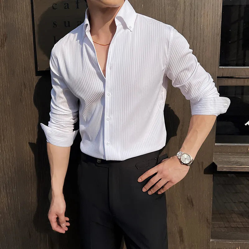 Man wearing a dark striped V-neck long sleeve shirt in a cardigan style.