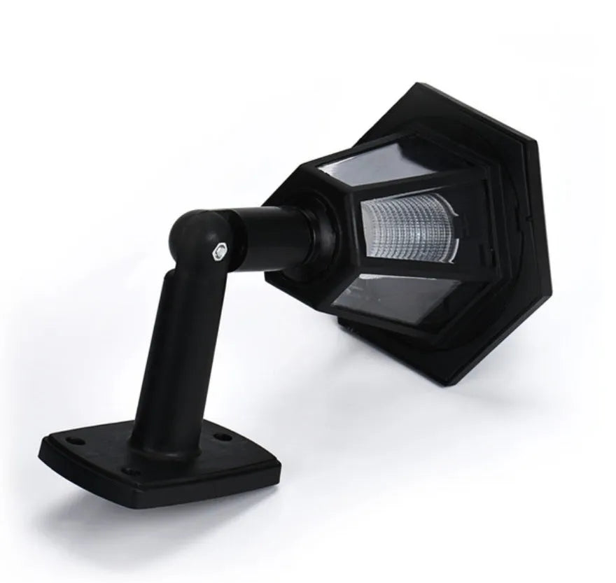 Black hexagonal solar-powered outdoor wall lamp with integrated solar panel