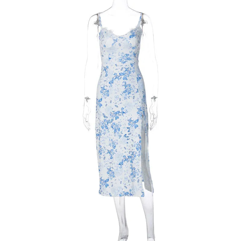 Women's long blue dress with lace flowers print, featuring suspender straps and a thigh-high slit.