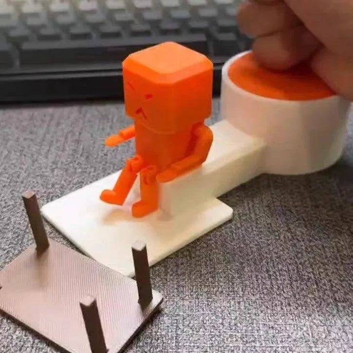 Orange plastic table-top decompression toy with turning parts