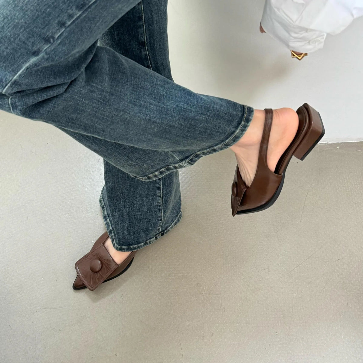 Women's low heel pointed toe sandals in apricot colour with a back strap
