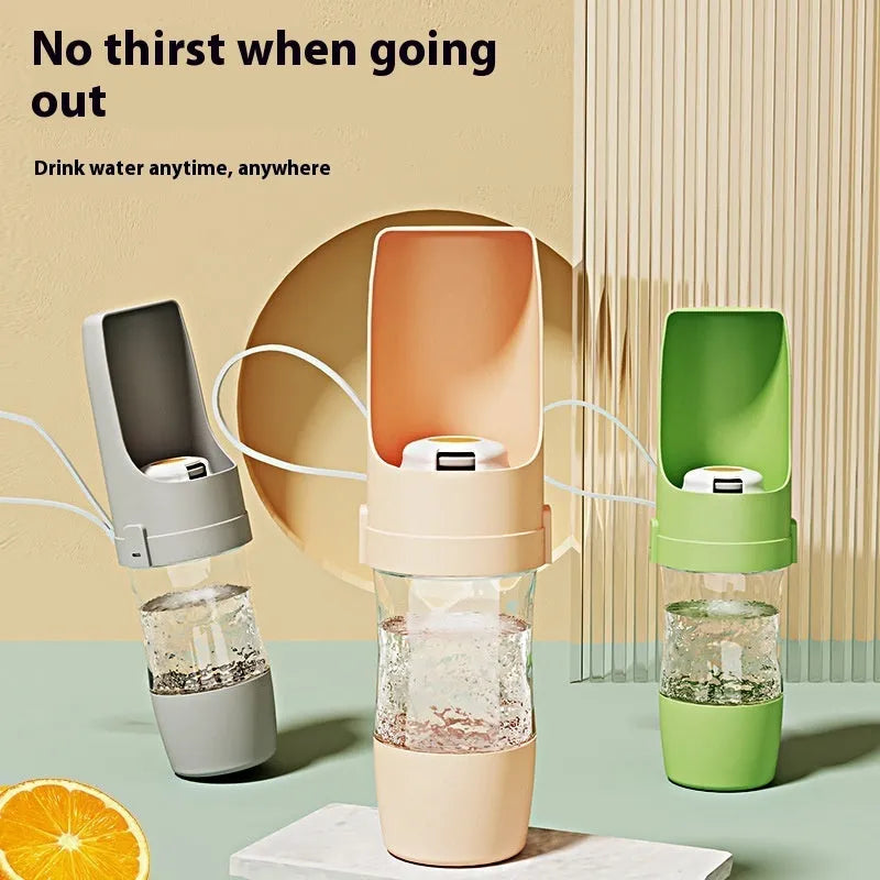 Grey portable 2-in-1 dog travel water bottle and feeder with detachable lanyard.