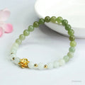 Hand-woven Hetian jade bracelet with sunshine water gradient colour and floral design.