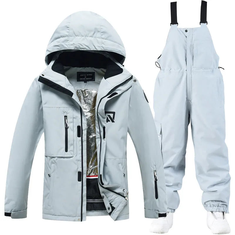 Blue and black unisex winter ski suit jacket and pants for snow sports.