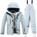 Blue and black unisex winter ski suit jacket and pants for snow sports.