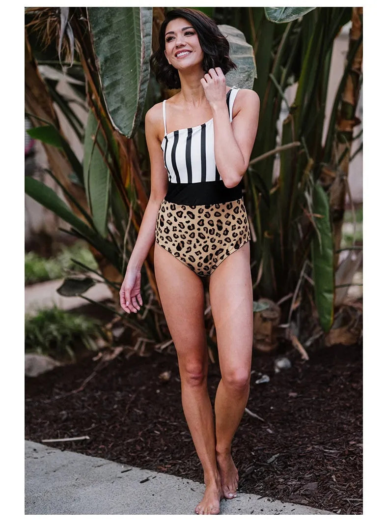 Leopard print women's one-piece swimsuit with high waist and asymmetric collar on a mannequin.