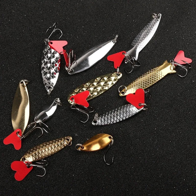 Box of pineapple sequin fishing lure crafting components with metal sequins and multi-colour fabric.