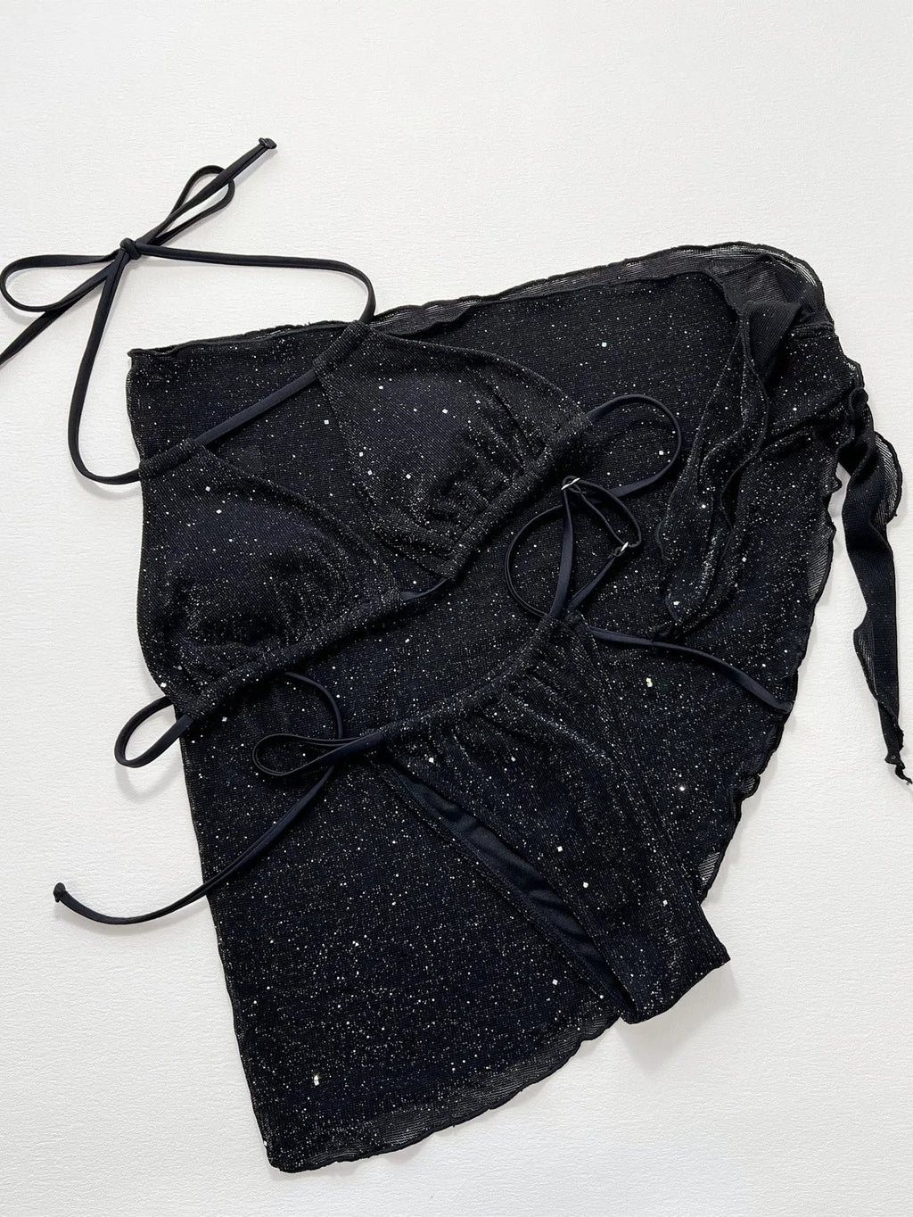 Black three-piece bikini set with bra top and shorts on a mannequin.