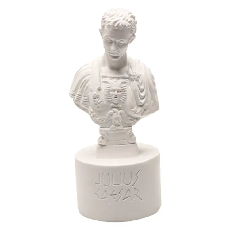 White American style character model pen holder made from synthetic resin on a desk.