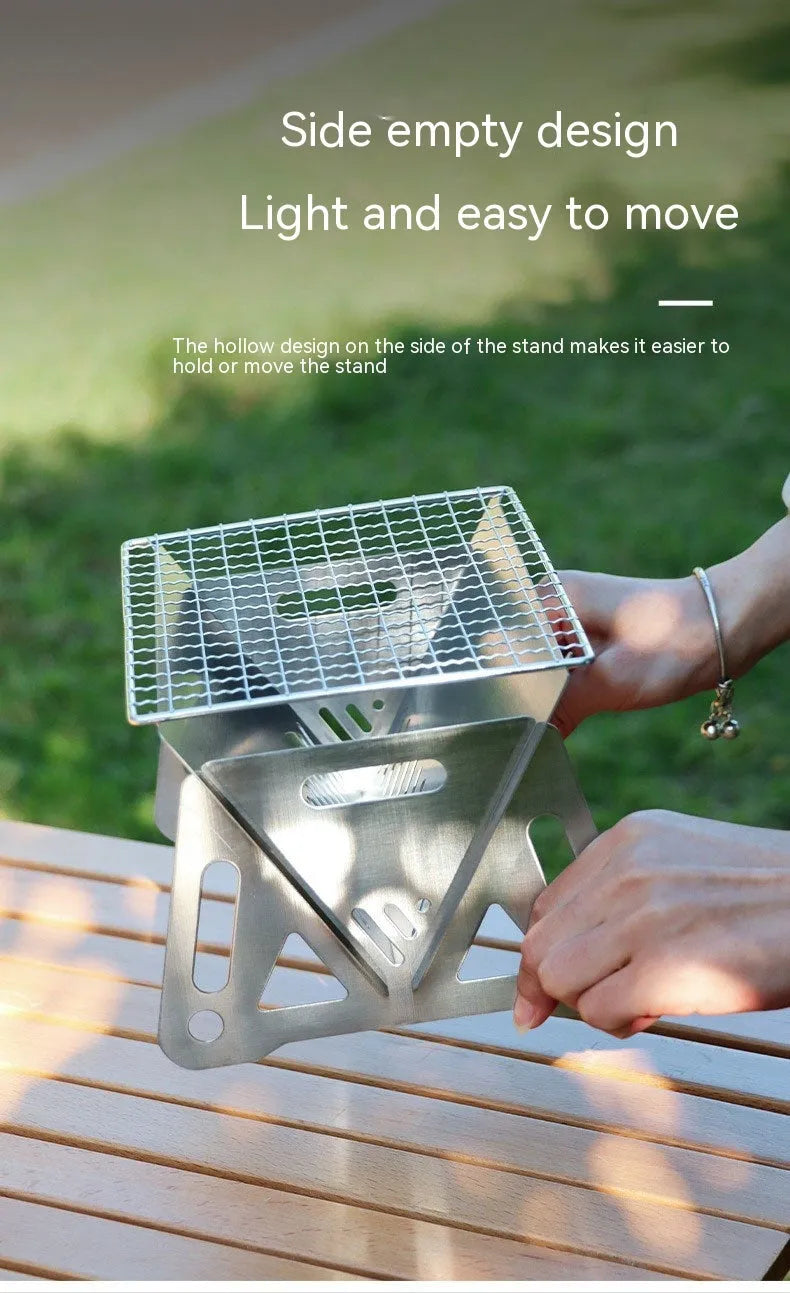 Folding stainless steel barbecue oven with grill rack, shown with storage bag