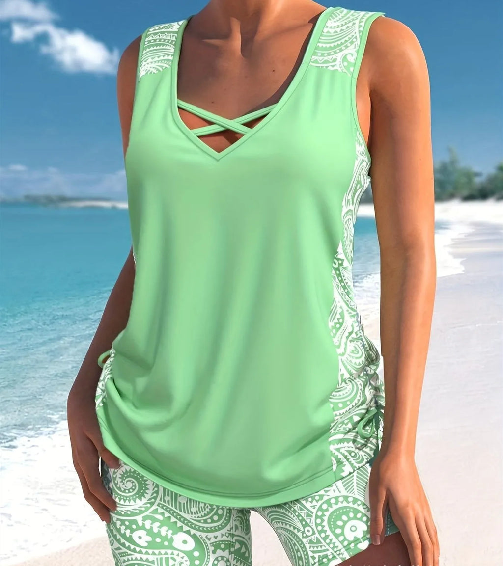 Women's two-piece swimsuit set with a top and printed boxer shorts in a solid colour.