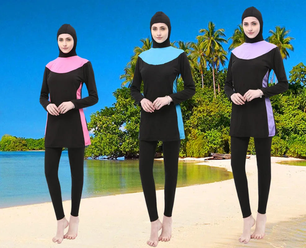 Women's black hooded long sleeve swimsuit top and pants for conservative swimming.