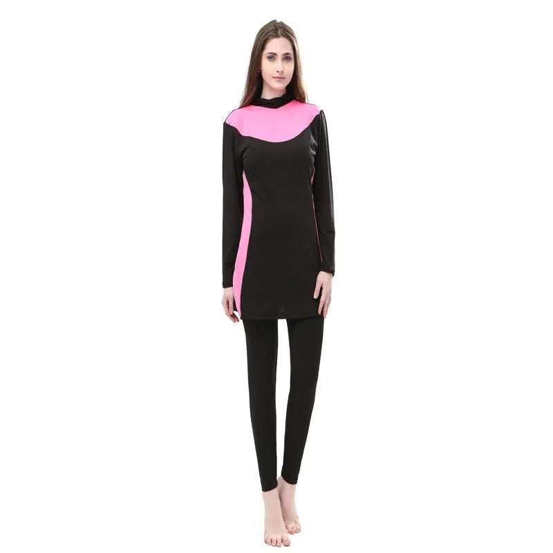 Women's black hooded long sleeve swimsuit top and pants for conservative swimming.