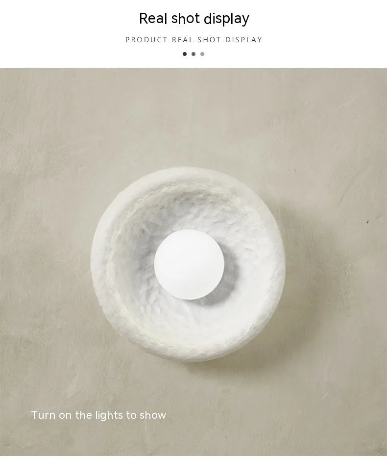 Japanese minimalist wall lamp with round resin shade in warm white light